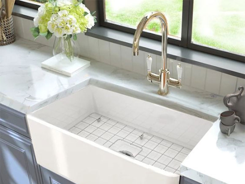 Kitchen sink with a basket strainer